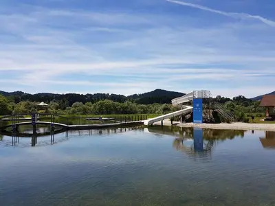 a bridge over a large body of water at Green Resort Glamping in Radlje ob Dravi