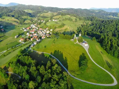 an aerial view of a small village in the hills at Apartment pri Damijanu in Ponikve