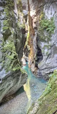a river in a rocky canyon with blue water at Apartment pri Damijanu in Ponikve