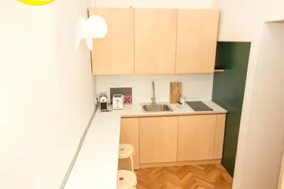an overhead view of a kitchen with wooden cabinets at Isabella Living in Maribor