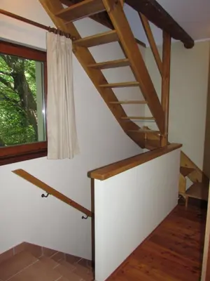 a staircase in a house with a window at Apartma Narnia in Bovec