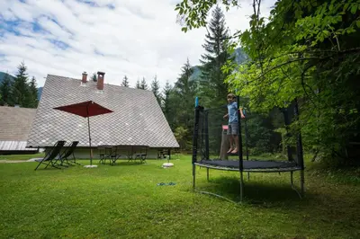 a person standing on top of a trampoline at Chalet Via Mons in Mojstrana