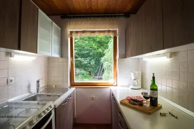 a small kitchen with a sink and a window at Chalet Via Mons in Mojstrana