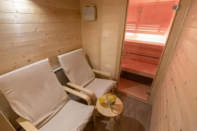 a small room with two chairs and a table at Slabnik Nature Escape in Idrija