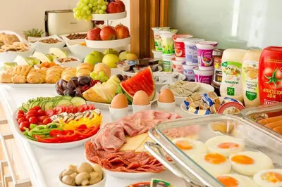 a buffet with many different types of food on a table at Villa Aina Boutique Hotel in Laško