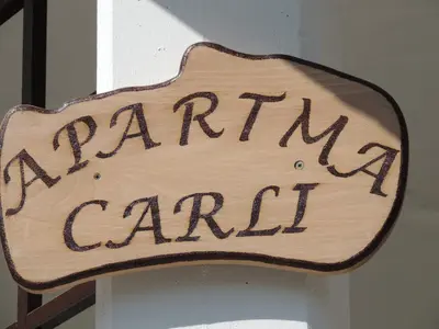 a sign that readsarma carilli hanging on a door at Apartment Carli-Jurč in Kobarid