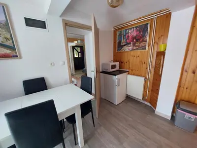 a kitchen and dining room with a table and chairs at Apartment Carli-Jurč in Kobarid