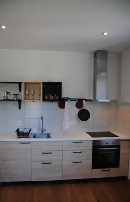 a kitchen with a sink and a stove at Apartment with Free Parking in Ljubljana