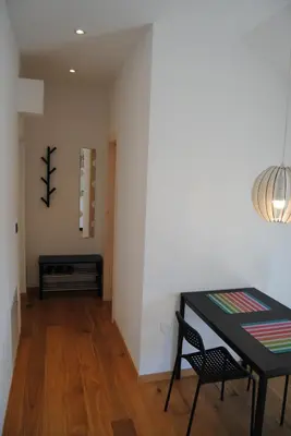 a dining room with a table and a chair at Apartment with Free Parking in Ljubljana