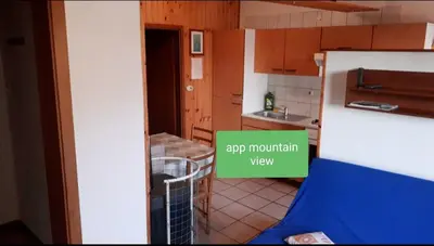a view of a kitchen with the words rip mountain view at Apartma NADIŽA in Borjana