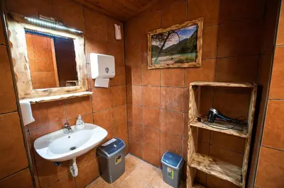 a bathroom with a sink and a mirror at Hostel Paradiso in Tolmin