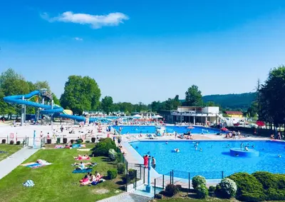 a group of people in a large swimming pool at Lucky home in Čatež ob Savi
