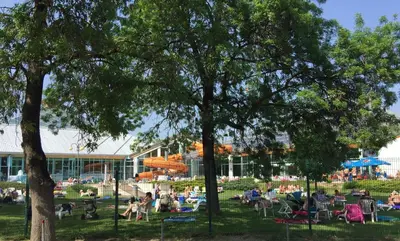 a group of people sitting in a park at Lucky home in Čatež ob Savi