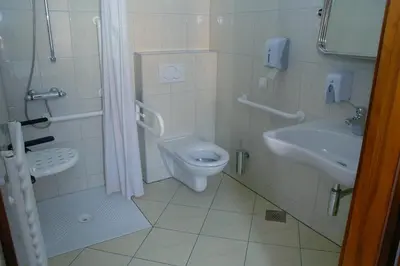 a bathroom with a toilet and a sink at Hotel & Hostel Marenberg Radlje in Radlje ob Dravi