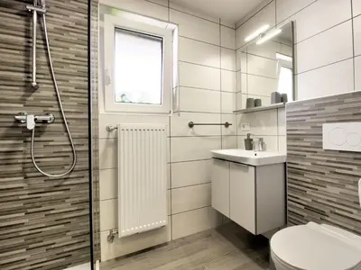 a bathroom with a shower and a toilet and a sink at Apartments Julijana in Bled
