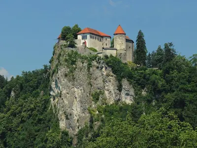a castle on the top of a mountain at Apartments Julijana in Bled