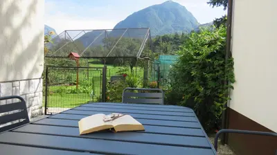 a blue table with a book and a napkin on it at D-D in Bovec