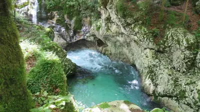 a pool of water in a river in a cave at D-D in Bovec