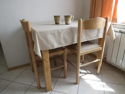 a table and two chairs with two cups on it at D-D in Bovec