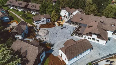 an overhead view of a large house with roofs at Terme Olimia - Aparthotel Rosa in Podčetrtek