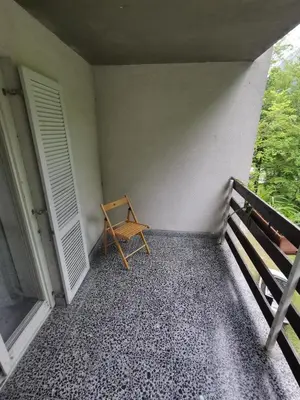 a small room with a bench and two doors at Hostel pod Voglom in Bohinj