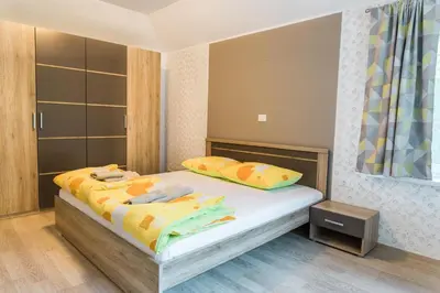 a bedroom with two beds with towels on them at Guest House Rosi in Tolmin