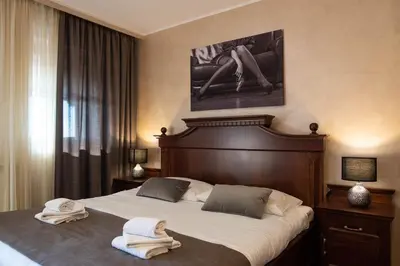 a bedroom with two towels sitting on a bed at Domačija pri Damjanu in Kozina