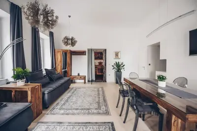 a living room with a couch and a table at Feel Ljubljana Centre in Ljubljana