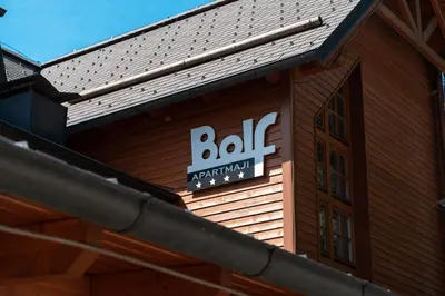 a sign on the side of a building at Luxury Apartments Bolf in Pohorje