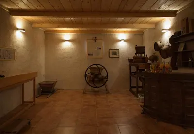 a room with a large room with a table and a wheel at GOSTel Koprivnik pri Kočevju, Kočevski Rog in Koprivnik