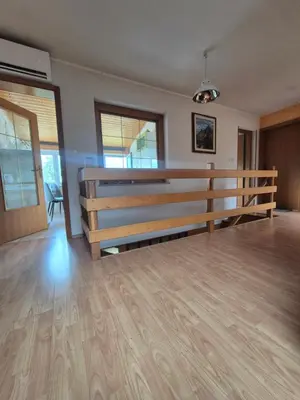 a living room with a wooden bench in a room at Apartment Bruna Vučič in Bovec