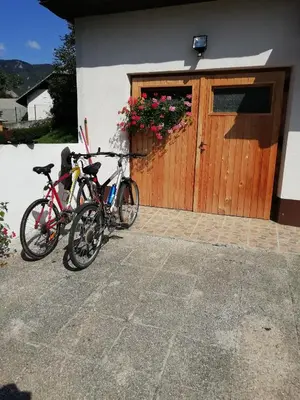 two bikes parked in front of a building at Apartma Pr' Vok in Lesce