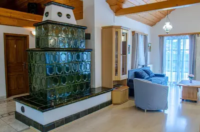 a living room with a large stack of glass bottles at Apartment Feher Lendava in Lendava