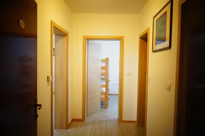 a hallway with an open door to a room at Ribiški dom Radeče in Radeče
