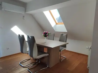 a dining room with a table and chairs at Apartmaji Mojca in Bohinj