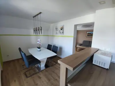 a dining room with a table and chairs at Apartmaji Mojca in Bohinj