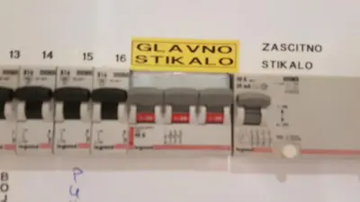 a close up of an electronic keyboard with a sign at Koča Predilnica Velika Planina in Kamniška Bistrica