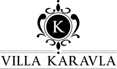 a black and white logo with a letter k at Karavla Private Villa in Šentilj