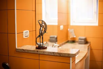 a kitchen counter with a statue on a counter top at Apartments Ole in Tolmin