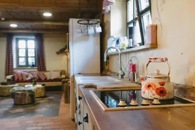 a kitchen with a sink and a counter top at Hostel Lukna in Mojstrana
