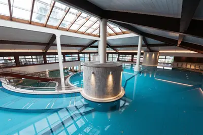 a large swimming pool with a cylinder in the middle of it at Hotel Ajda Depandance Prekmurska Vas - Terme 3000 - Sava Hotels & Resorts in Moravske Toplice