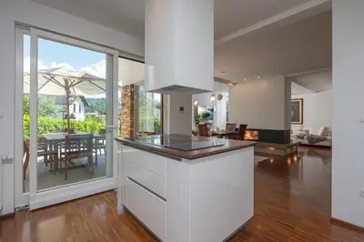 an open kitchen with a view of a living room at Luxury Apartment Nana in Bled