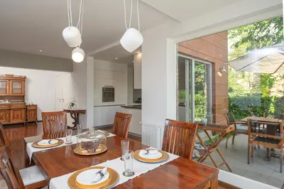 a kitchen and dining room with a table and chairs at Luxury Apartment Nana in Bled