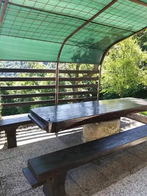 a wooden bench sitting under a tent at Getaway 
