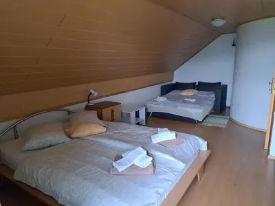 a room with two beds with towels on them at Getaway 