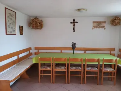 a dining room with a green table and chairs at Getaway 
