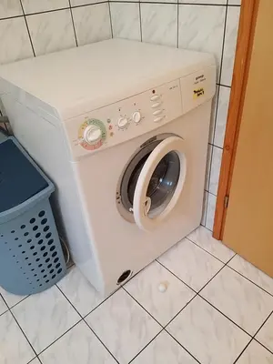 a washer and dryer sitting in a room at Getaway 