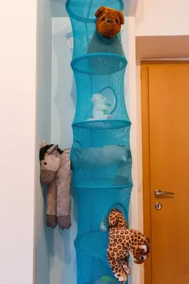 a blue shelf with stuffed animals in a room at Apartments Lake Bohinj Medja in Bohinj