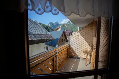 a view of a balcony from a window of a building at Apartment Tinka Kranjska Gora in Kranjska Gora
