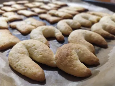 a group of cookies forming a heart on a baking sheet at Tourist Farm Strle With Great Local Food in Cerknica